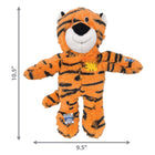 KONG Wild Knots Tiger Dog Toy in medium/large size, measuring 10.5 inches tall and 9.5 inches wide. The plush toy resembles a tiger with an orange body and black stripes, featuring a white muzzle, black nose, and a cheerful smile. The toy has soft, floppy arms and legs, with fabric patches in yellow and blue stitched onto its body for a playful, rugged design. It includes an internal knotted rope skeleton for durability and a built-in squeaker for interactive play.