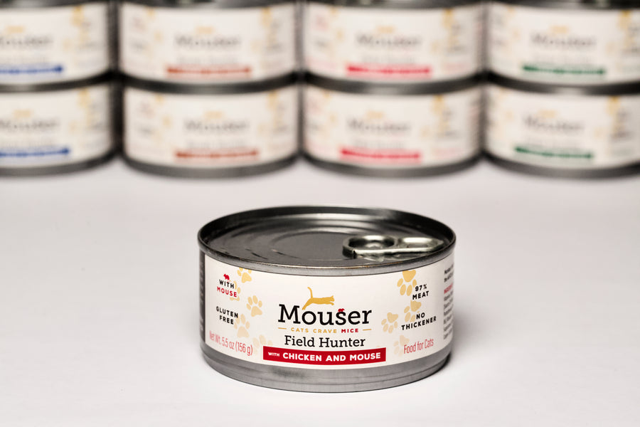 Mouser Field Hunter Canned Cat Food. With Chicken & Mouse, Other Flavors visible in the background. Gluten Free, BPA Free Can, No Thickener