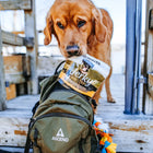 Dog getting Ultimates Jerky Mini Strips with Chicken Dog Treats Pouch from a bag