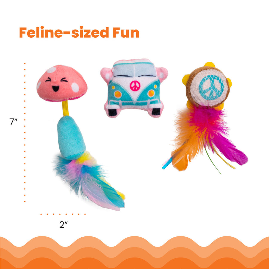 Three colorful cat toys sized for play: a smiling pink mushroom with a blue stem and rainbow feather tail, a teal and pink cartoon van with a peace symbol, and a tambourine-shaped toy with orange and purple feathers. Dimensions shown as 7 inches tall by 2 inches wide. Feline-sized Fun.