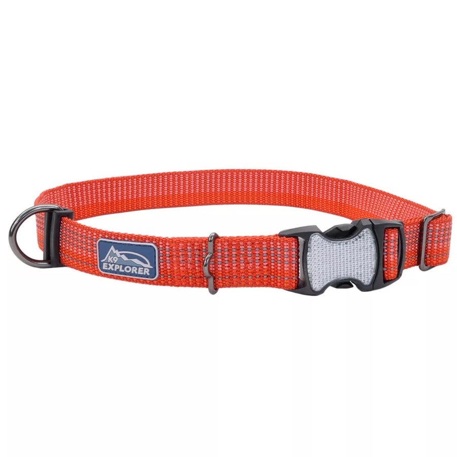 Red collar with reflective material woven in the fabric. The pinch buckle is closed, showing reflective material on the buckle.
