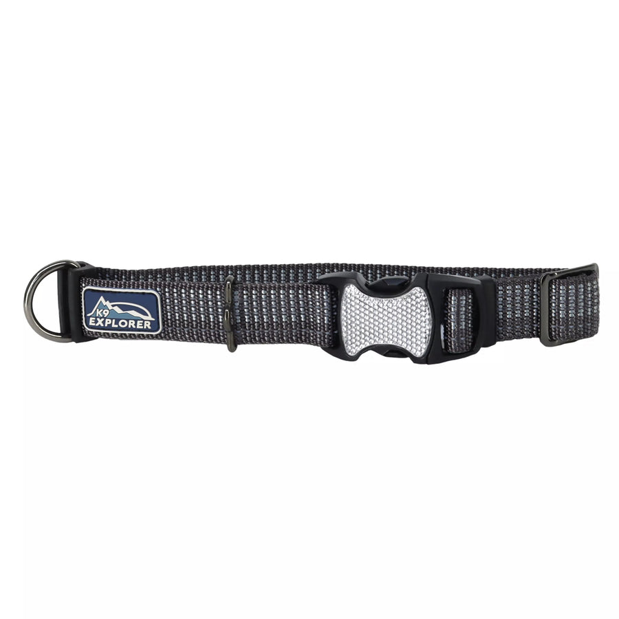 Black collar with reflective material woven in the fabric. The pinch buckle is closed, showing reflective material on it.