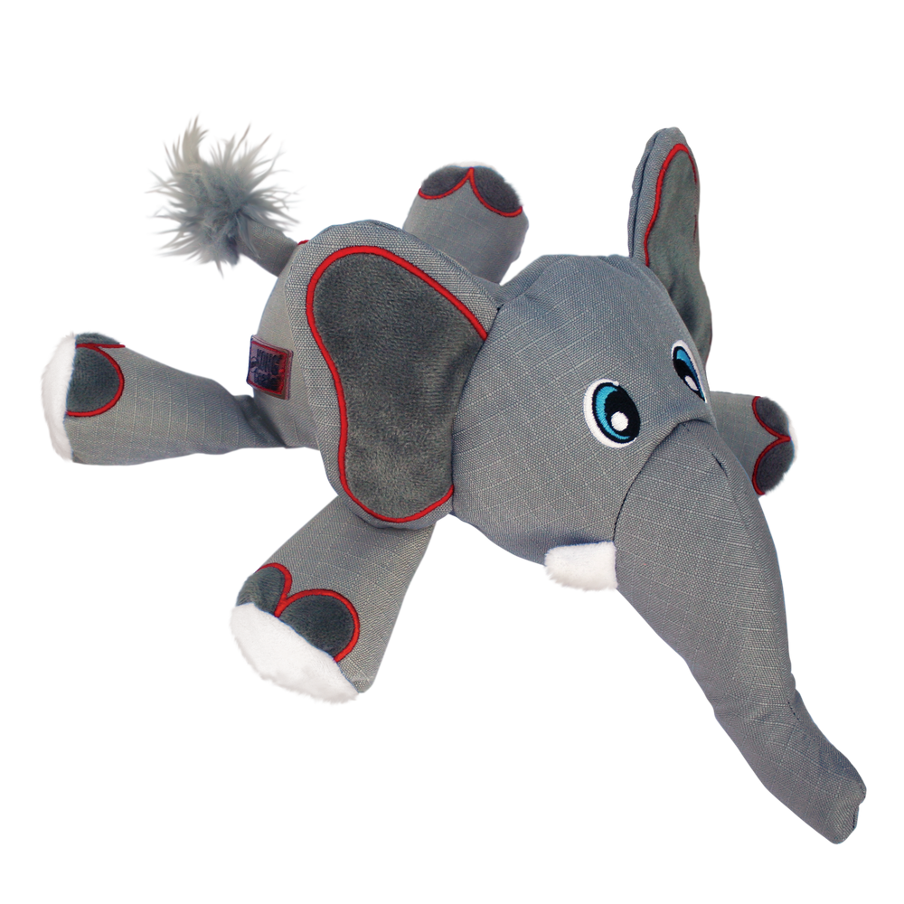 KONG Cozie Ultra Ella Elephant dog toy in gray. The plush elephant has a soft yet durable fabric body with red-outlined ears and limbs, a long trunk, and embroidered eyes. White accents on the feet and tusks add detail, and a fluffy tail enhances the playful design. The toy is designed for interactive play and cuddling.