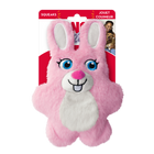 A KONG Snuzzles Kiddos Bunny plush dog toy in its original packaging. The toy is a soft, round, pink bunny with a fuzzy texture. It features embroidered blue eyes with long lashes, a white muzzle with a pink plush nose, a stitched black smile, and two front teeth. The bunny has long, upright ears with white inner linings and a white fluffy patch on its chest. The packaging is red and white, displaying the KONG logo, the word 'Snuzzles'. The packaging also highlights that the toy squeaks.