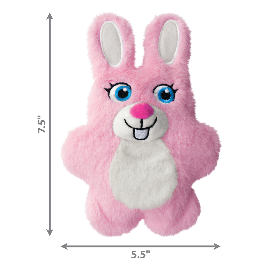 A KONG Snuzzles Kiddos Bunny plush dog toy, measuring approximately 7.5 inches in height and 5.5 inches in width. The toy is a soft, round, pink bunny with a fuzzy texture. It features embroidered blue eyes with long lashes, a white muzzle with a pink plush nose, a stitched black smile, and two front teeth. The bunny has long, upright ears with white inner linings and a white fluffy patch on its chest. Measurement arrows along the sides indicate the toy’s dimensions.