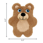 A KONG Snuzzles Kiddos Teddy plush dog toy without packaging. The toy is a small, soft, light brown teddy bear with a fuzzy texture. It has bright embroidered blue eyes, a black nose, and a stitched smiling mouth. A beige patch covers its belly, adding contrast to the brown fur. The dimensions of the toy are labeled on the image, measuring 6.5 inches in height and 5.5 inches in width.