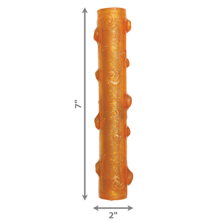 An orange KONG Squeezz Crackle Stick dog toy with a textured cylindrical shape and raised bumps, designed for interactive chewing and crackling sounds. The dimensions of the toy are indicated with arrows: 7 inches in height and 2 inches in width.