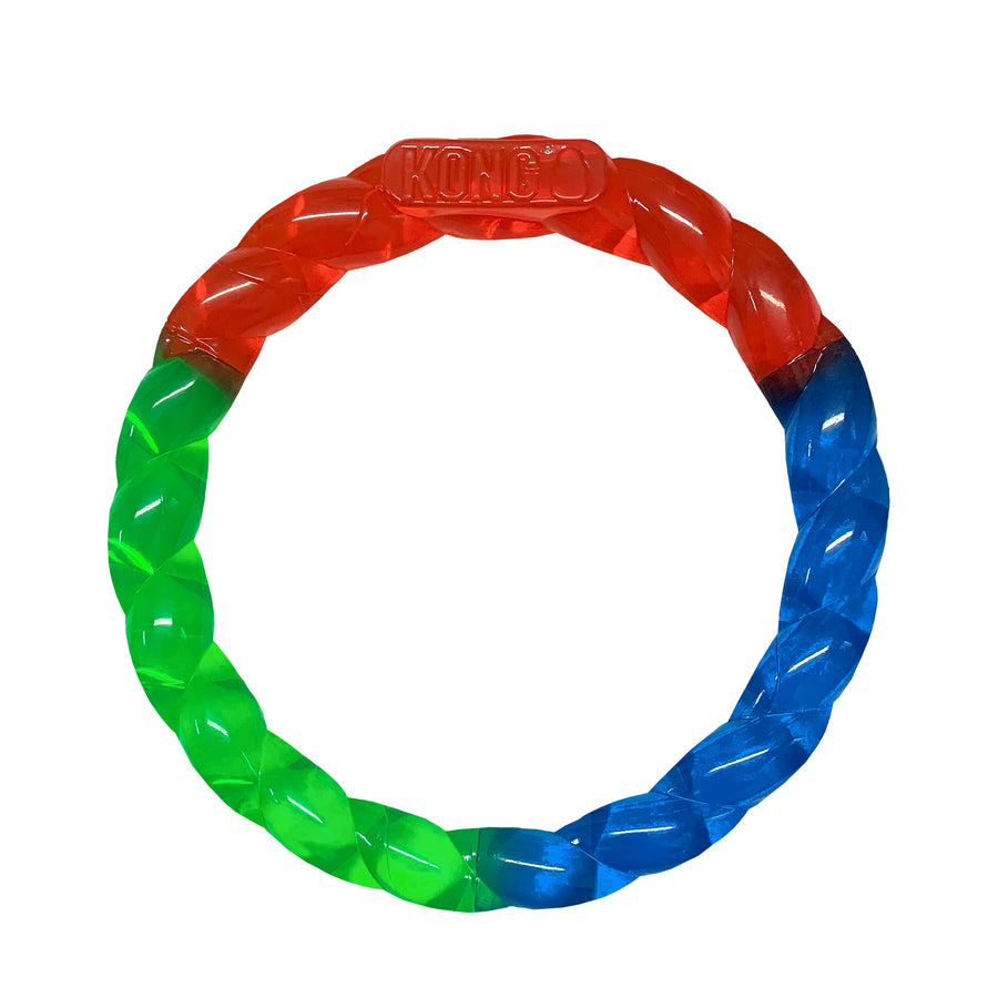 A KONG Twistz Ring Dog Toy featuring a circular, braided design made of durable, flexible material. The toy is tri-colored with sections of red, blue, and green, and has a translucent finish. The 'KONG' logo is embossed on the top of the ring. Designed for interactive play, fetching, and chewing.