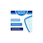 Silica gel crystals. Safe, non-toxic. Superior moisture and odor absorption. Less litter per cat, less waste in landfills. Top view of litter pan with white crystals with blue dots.