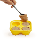 Hand filling Woof Pupsicle Silicone Treat Tray with food