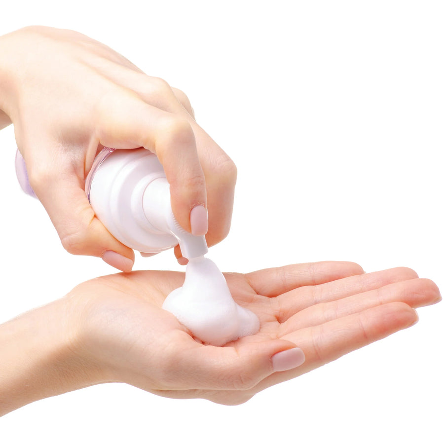 PURE and Natural Pet Organic Waterless Foaming Cat Shampoo squeezed into a hand