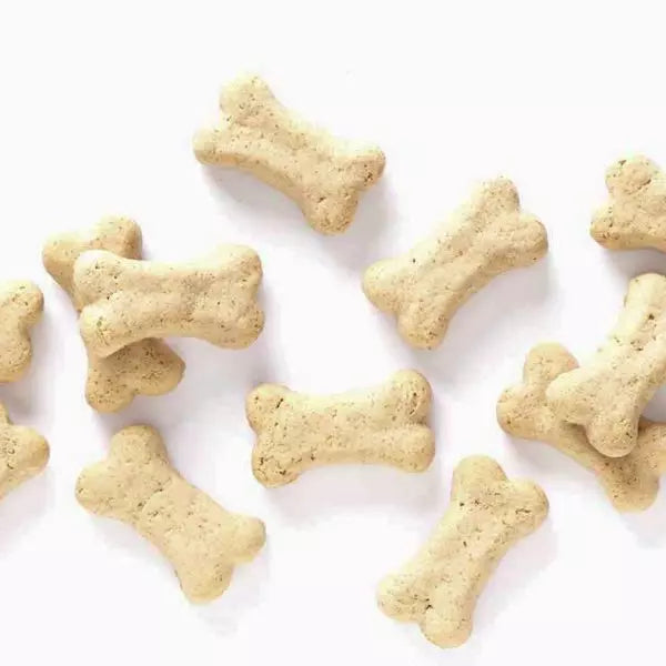 A few pieces of SPORTMiX Wholesomes Gourmet Rewards Puppy Original Treats for Dogs