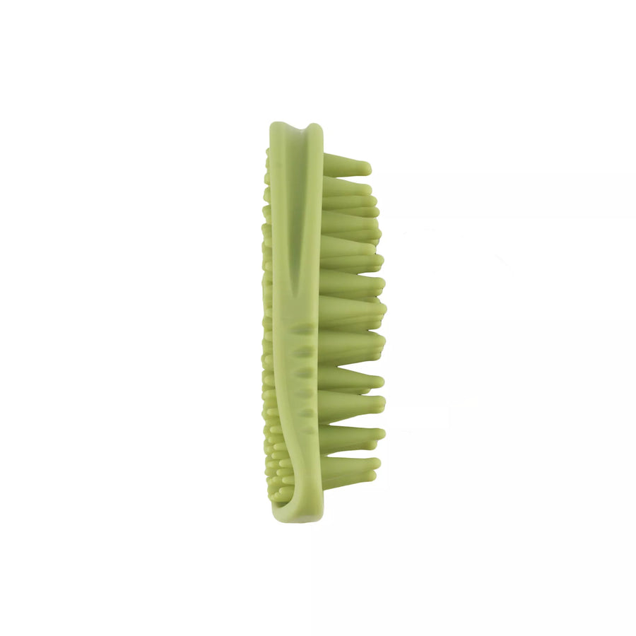 Green palm brush with rounded, rubberized brush teeth. Brush positioned up right, side view of brush. Back brush short bristles, front of brush long bristles. Safari Soft Tip Massager Cat Brush.