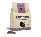 A beige and purple bag of Vital Essentials Frozen Raw Turkey Entree Mini Patties for cats. The bag features the Vital Essentials logo and the text 'Frozen Raw Turkey Entree Cat Food Mini Patties.' The packaging highlights benefits like grain and gluten-free, proudly American crafted, and made with turkey, heart, and liver. A silhouette of a turkey is displayed on the front. A few of the brown mini patties are scattered at the base of the bag, showing their square shape and food texture.