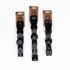 Three Wilderdog Orca ultralight dog collars in Small, Large, and Medium sizes displayed on branded kraft paper hang tags against a white background, showing black chevron pattern webbing.
