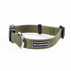 Wilderdog Olive waterproof dog collar looped upright on white background, showing olive green coated webbing with subtle topo map line pattern, silver D-ring, black quick-release buckle and slider, and Wilderdog logo patch.