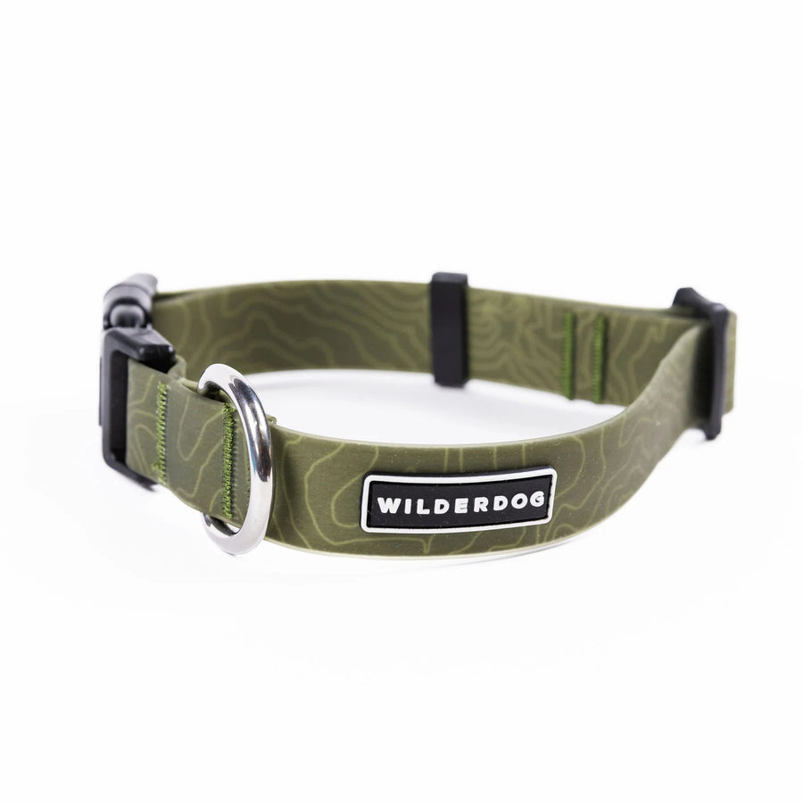 Wilderdog Olive waterproof dog collar looped upright on white background, showing olive green coated webbing with subtle topo map line pattern, silver D-ring, black quick-release buckle and slider, and Wilderdog logo patch.