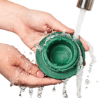 Woof Pupsicle Dog Treat Toy Green washed under a faucet