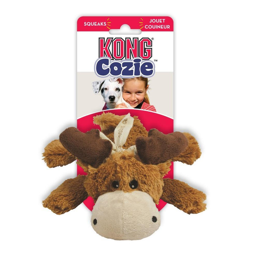 KONG Cozie plush moose dog toy in its original packaging. The toy is brown with dark brown antlers and a beige snout, featuring a soft, fuzzy texture. The packaging has a red and white design with the 'KONG Cozie' logo. The text on the package highlights that the toy squeaks.