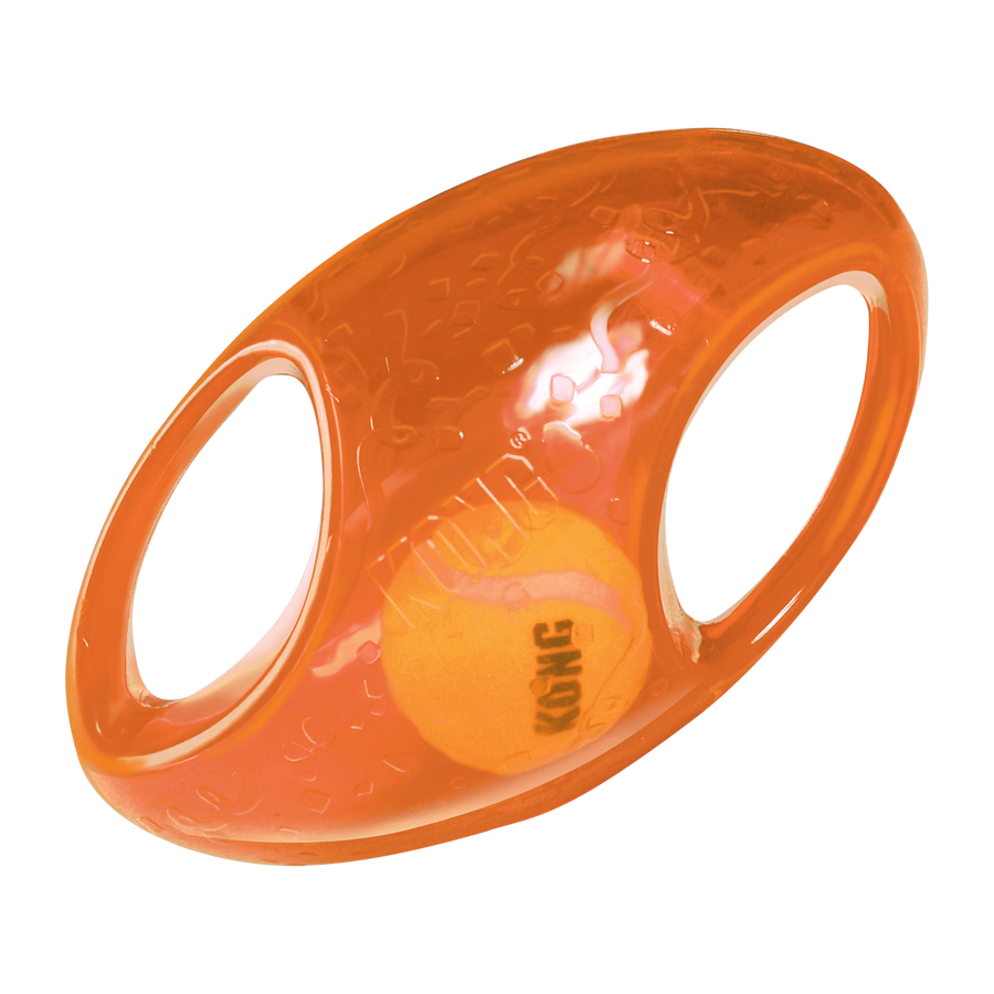 An orange KONG Jumbler Football Dog Toy featuring a transparent, durable rubber outer shell with two built-in handles for easy gripping. Inside the toy, a smaller KONG-branded tennis ball is visible, designed to create an engaging, interactive play experience for dogs.