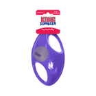 A purple KONG Jumbler Football Dog Toy in its packaging. The toy features a durable, transparent rubber outer shell with two built-in handles for easy gripping. Inside the toy, a smaller KONG-branded tennis ball is visible. The packaging at the top is red and white, displaying the KONG Jumbler logo along with the words 'Dogs Need to Play' and indicating that the toy squeaks.